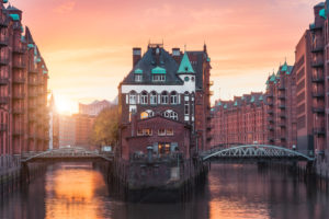 Hamburg Old Port, Germany, Europe, historic warehouse district with moated palace in the golden light of sunset Hamburg Old Port, Germany, Europe, historic warehouse district with moated palace in the golden light of sunset